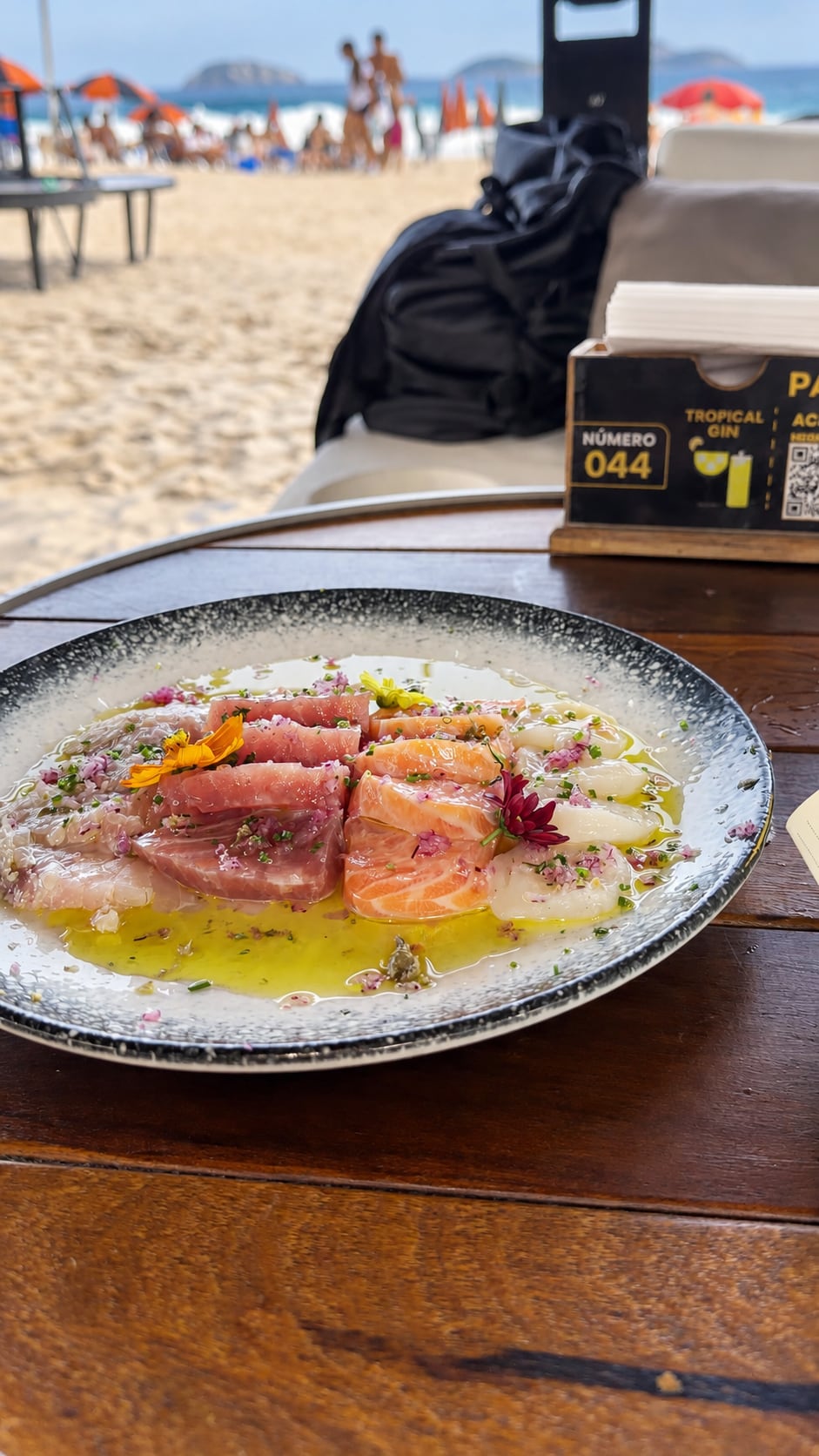 Seafood on a table beside a beach
