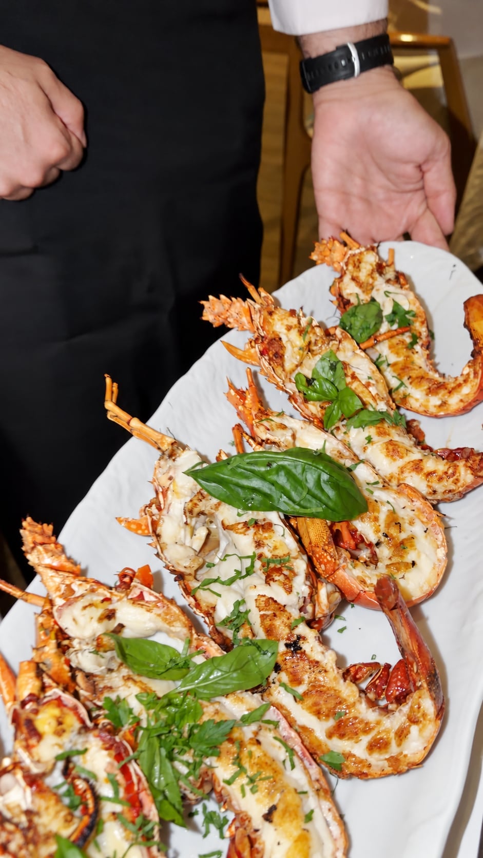 Seafood platter being served at a restaurant table